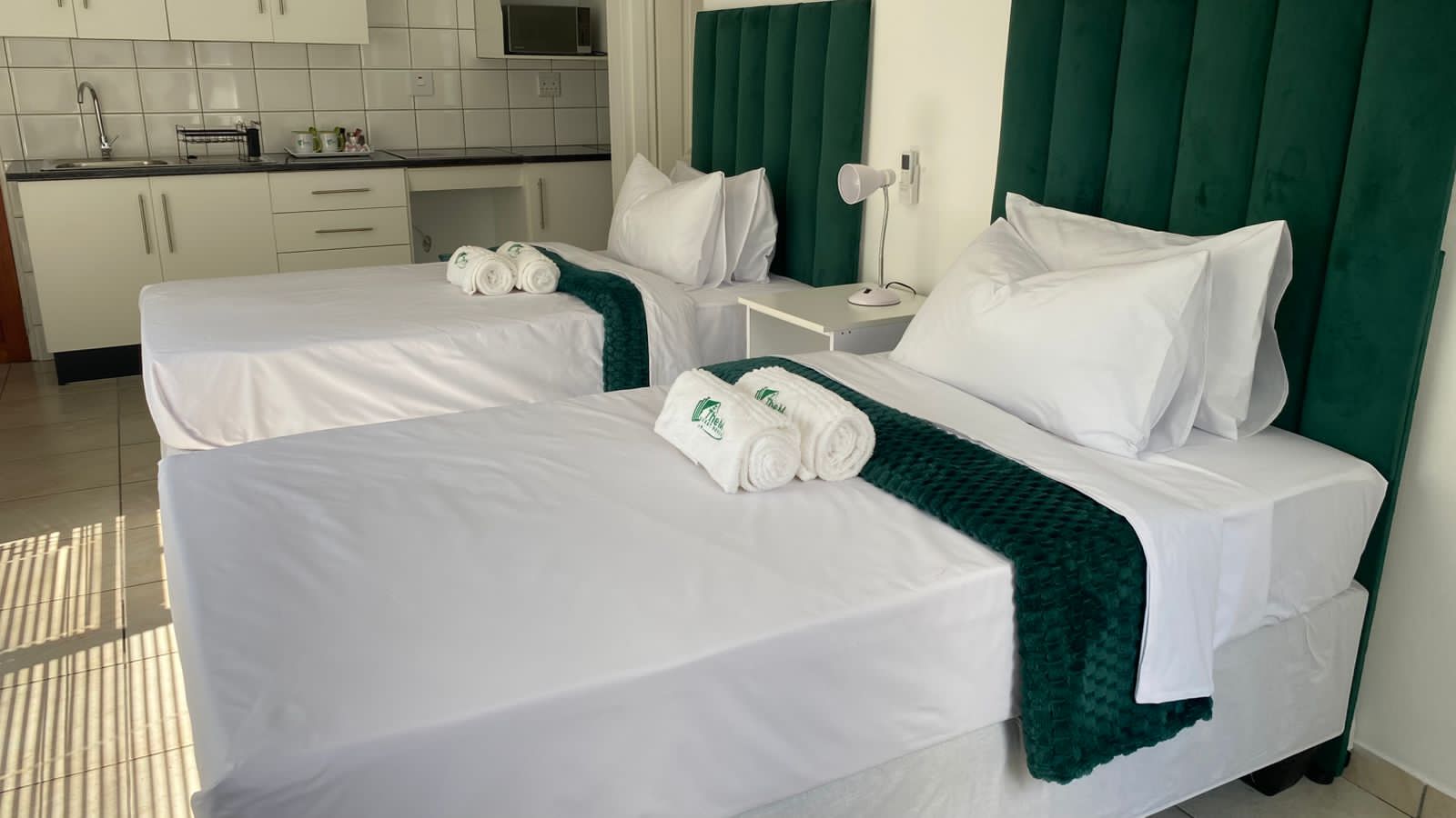 Spacious family room with multiple beds and comfortable furnishings