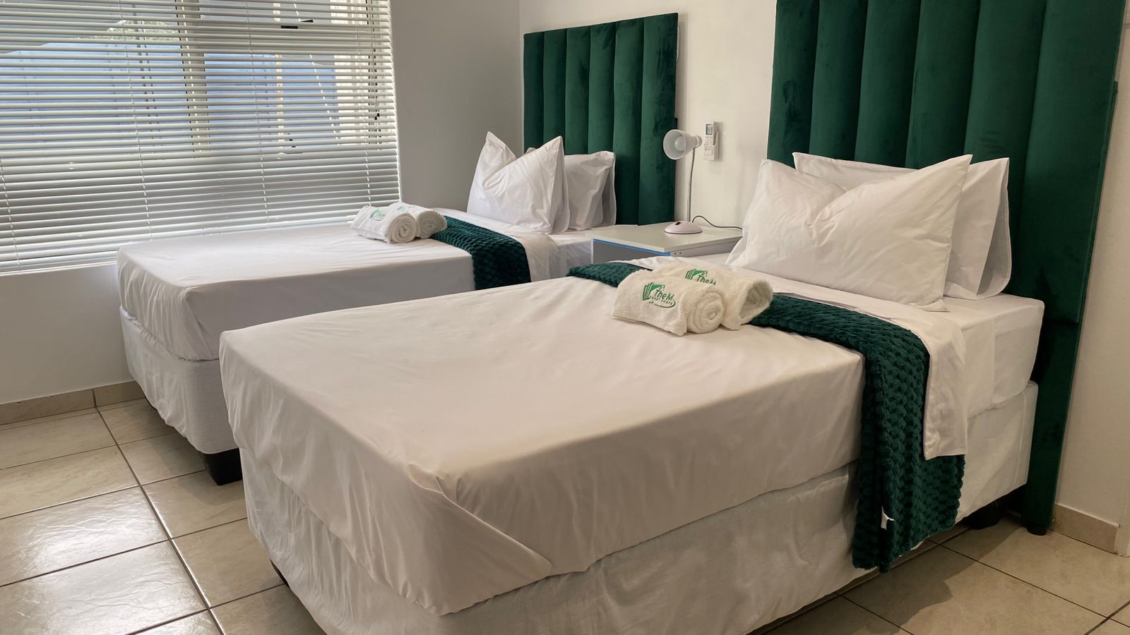 Family room with multiple beds and lounge area