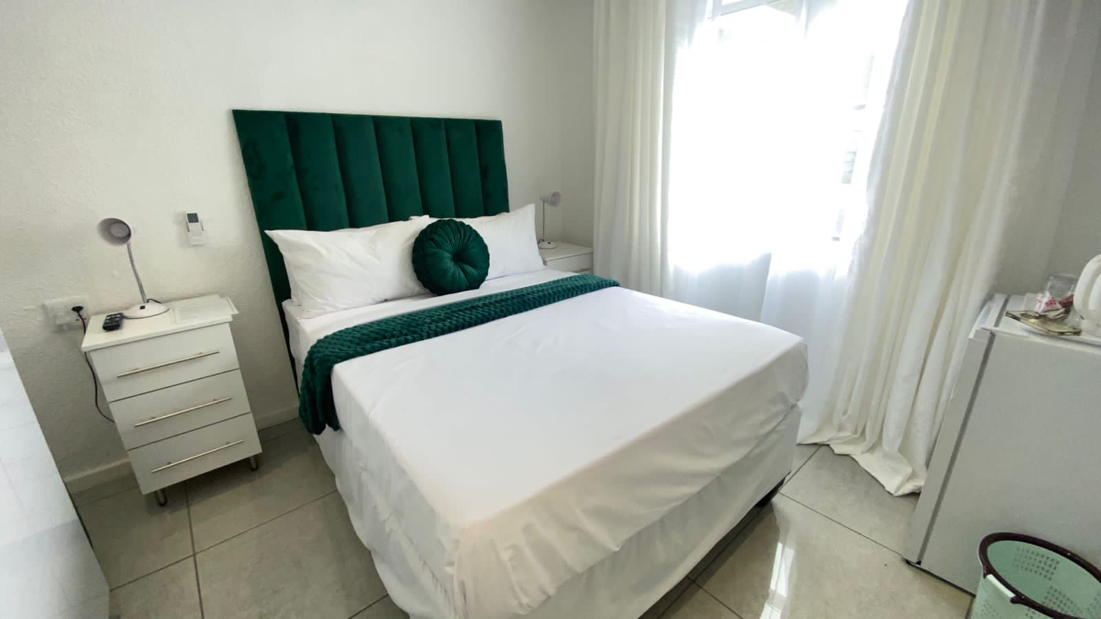 Comfortable standard room with double bed and modern furnishings